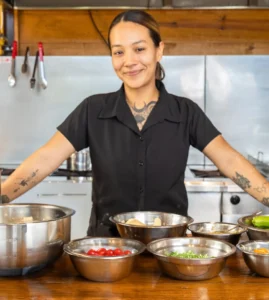 Producer with all the ingredients for her sauces